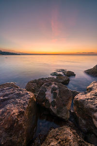 Scenic view of sea against sky during sunset