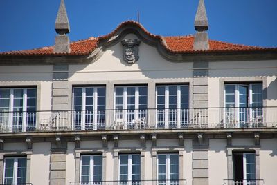 Low angle view of building against blue sky