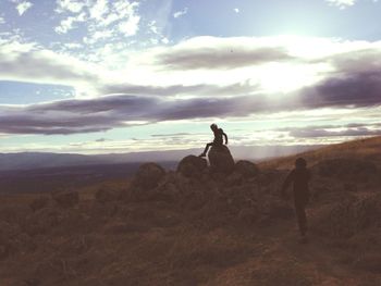 Man on landscape against sky