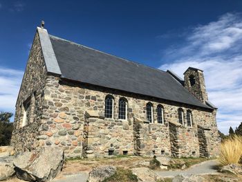 Low angle view of old building against sky