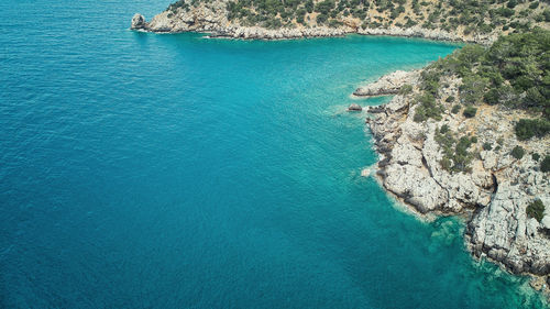 High angle view of rocks on sea