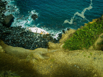 High angle view of shipwreck on beach