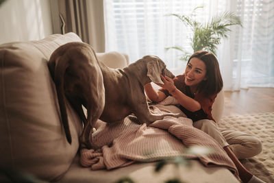 Young woman sleeping on bed at home