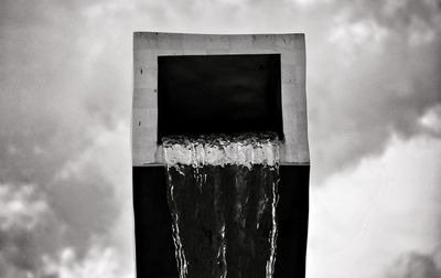 Low angle view of fountain against sky