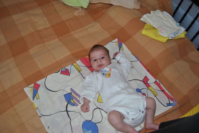 Cute baby lying on bed