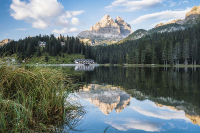 Scenic view of lake and mountains against sky