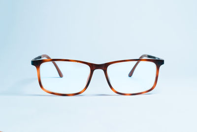 Close-up of eyeglasses against white background
