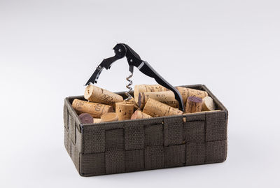 Close-up of wicker basket on white background