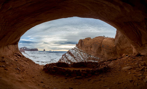 Panoramic view of rocks on beach against sky