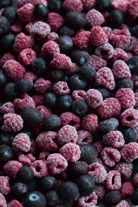 Frozen blueberries and raspberries, full frame