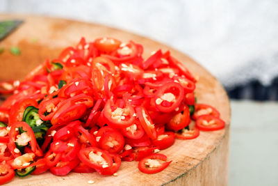 Close-up of red chili peppers on cutting board