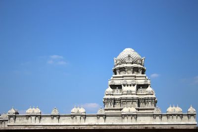 Low angle view of historical building against blue sky