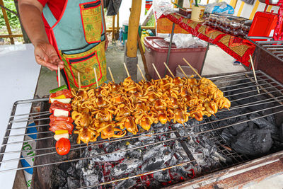 High angle view of meat on barbecue grill