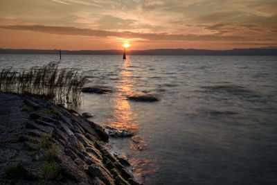 Scenic view of sea against sky during sunset