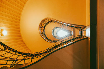 Low angle view of spiral staircase in building