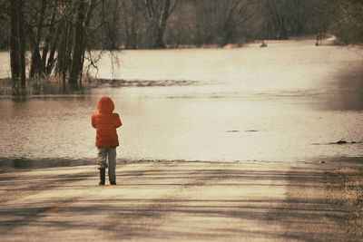 Full length of woman standing on shore