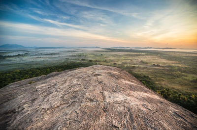 Scenic view of landscape against sky during sunset