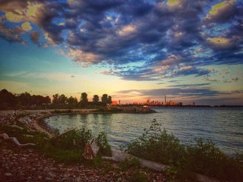 Scenic view of sea against cloudy sky