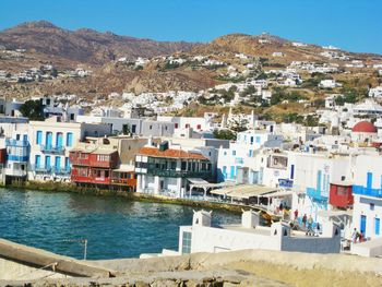 Scenic view of residential district and mountain