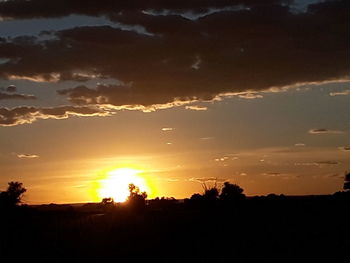 Scenic view of silhouette landscape against sky during sunset