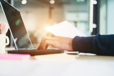 Man using laptop on table