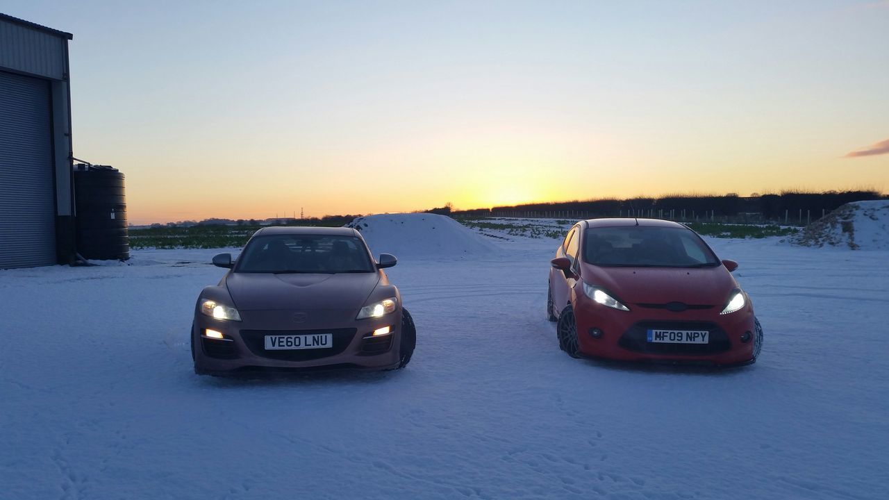 winter, snow, transportation, cold temperature, mode of transport, season, sunset, car, clear sky, land vehicle, weather, copy space, orange color, covering, nature, building exterior, sky, beauty in nature, travel, outdoors