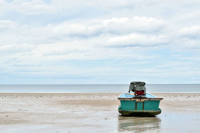 Boat in sea against sky
