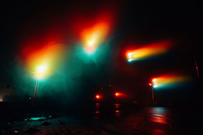 Illuminated street lights at night