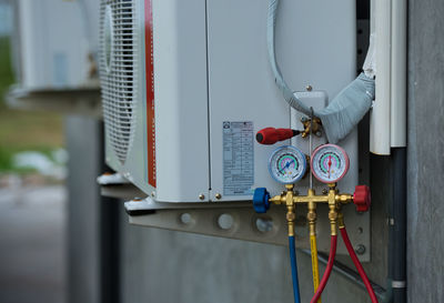 Low angle view of gauges on air conditioner