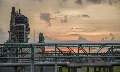 Refinery tower at a petrochemical plant with cloudy sky. after sunset.