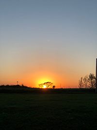 Scenic view of silhouette landscape against clear sky during sunset