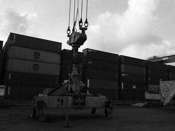 Man working at construction site against sky