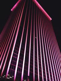 Low angle view of illuminated building at night