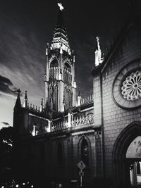 Low angle view of clock tower in city