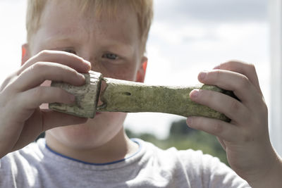 Close-up of boy playing with toy