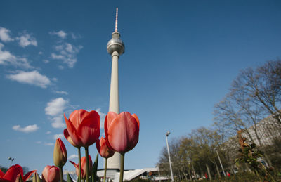 Low angle view of red tower against sky