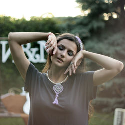 Portrait of a young woman in a park