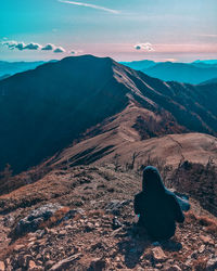 Rear view of mountain range against sky