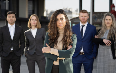 Portrait of business colleagues standing in office