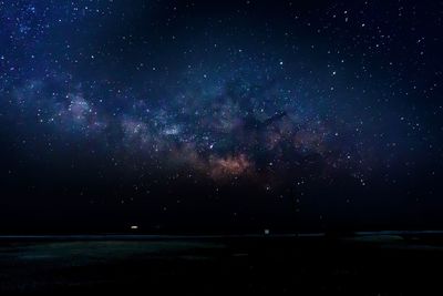 Scenic view of star field against sky at night