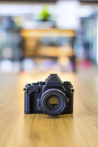 Close-up of camera on table