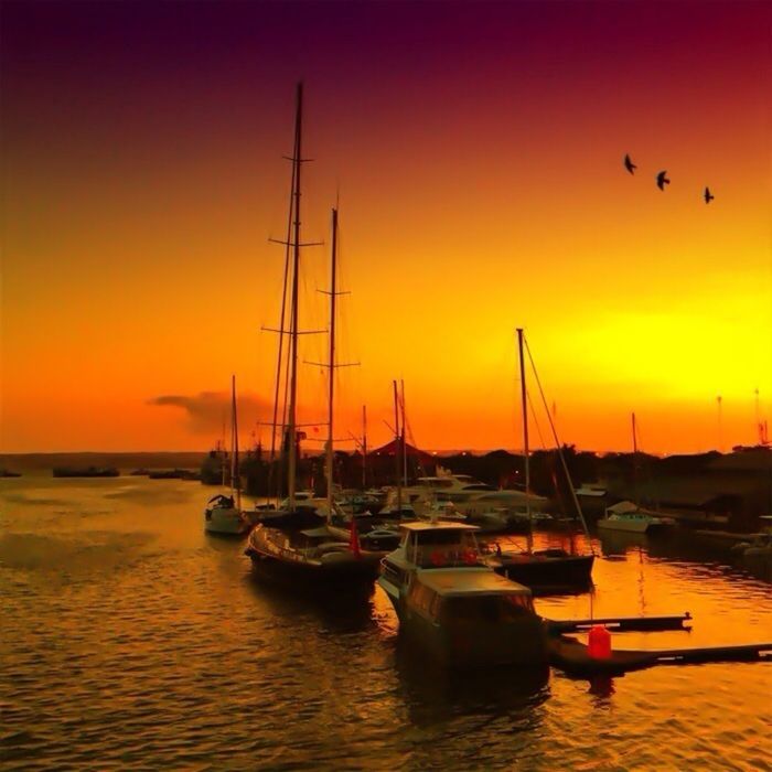 sunset, nautical vessel, transportation, boat, mode of transport, water, orange color, moored, sea, sailboat, mast, waterfront, sky, beauty in nature, scenics, tranquil scene, silhouette, nature, harbor, sun