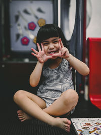 Cute boy sitting at home