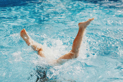 Man swimming in pool