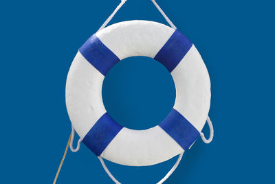 Close-up of umbrella against clear blue sky