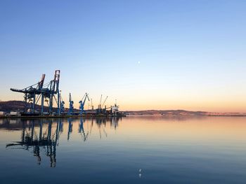 Scenic view of sea against clear sky during sunset