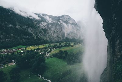 Scenic view of landscape and waterfall