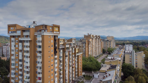 Buildings in city against sky