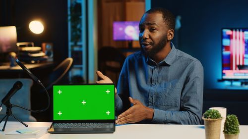 Young man using laptop at table