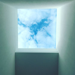 Low angle view of sky seen through window